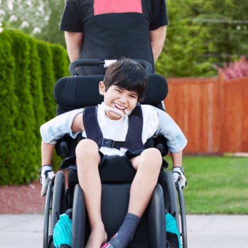 kid_riding_in_portable_wheelchair.png