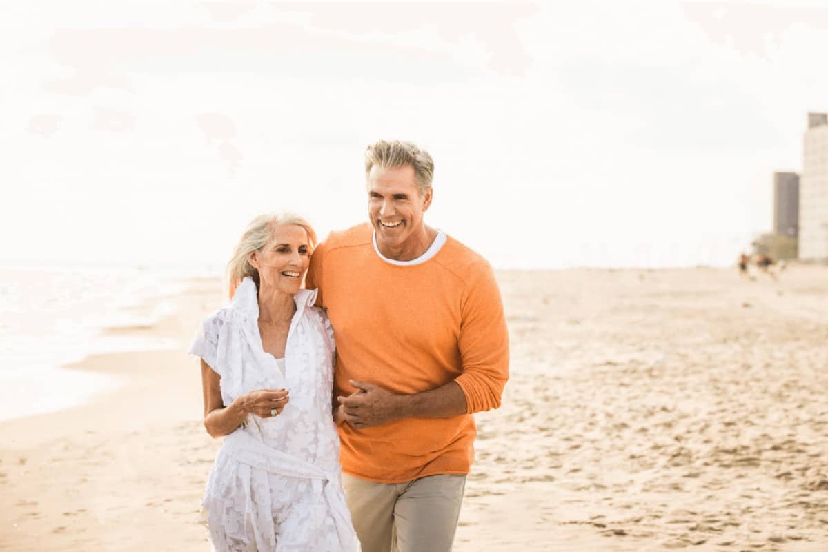 a senior couple walking down the beach, a sample of dating in your 60s