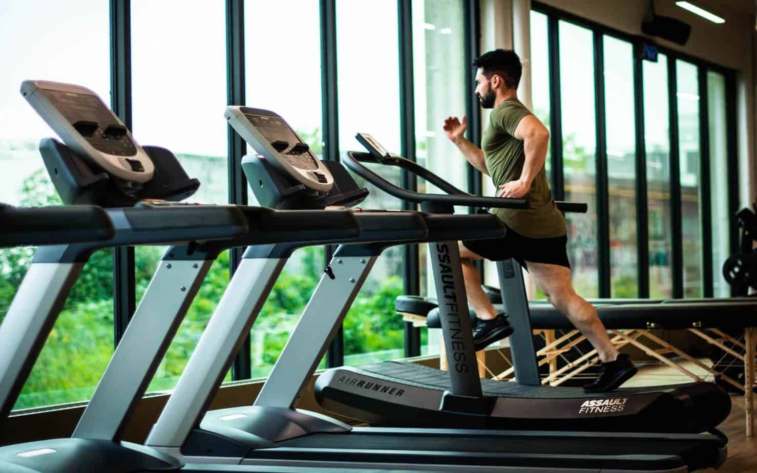 a man using a treadmill as his hiit workout