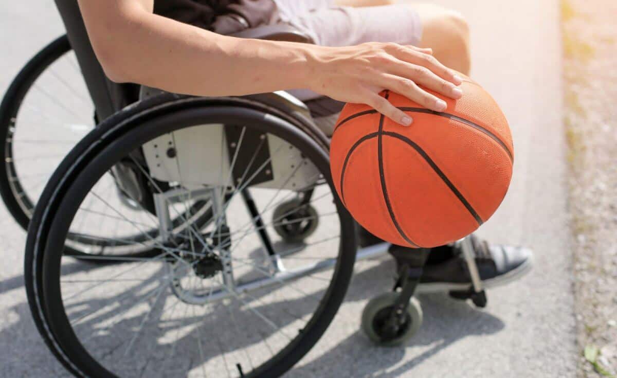 wheelchair user playing basketball