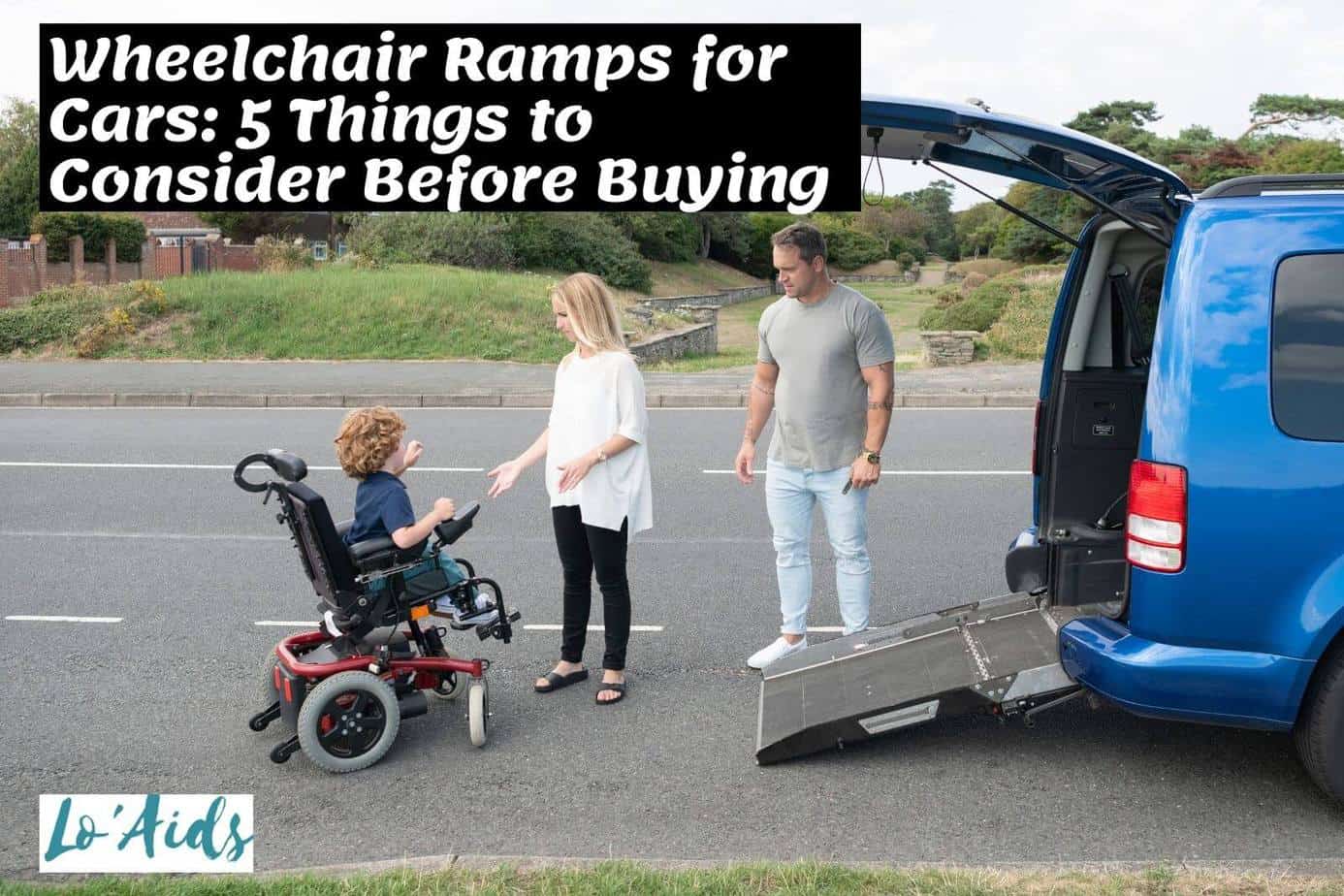 parents helping their kid in a wheelchair while using foldout ramp