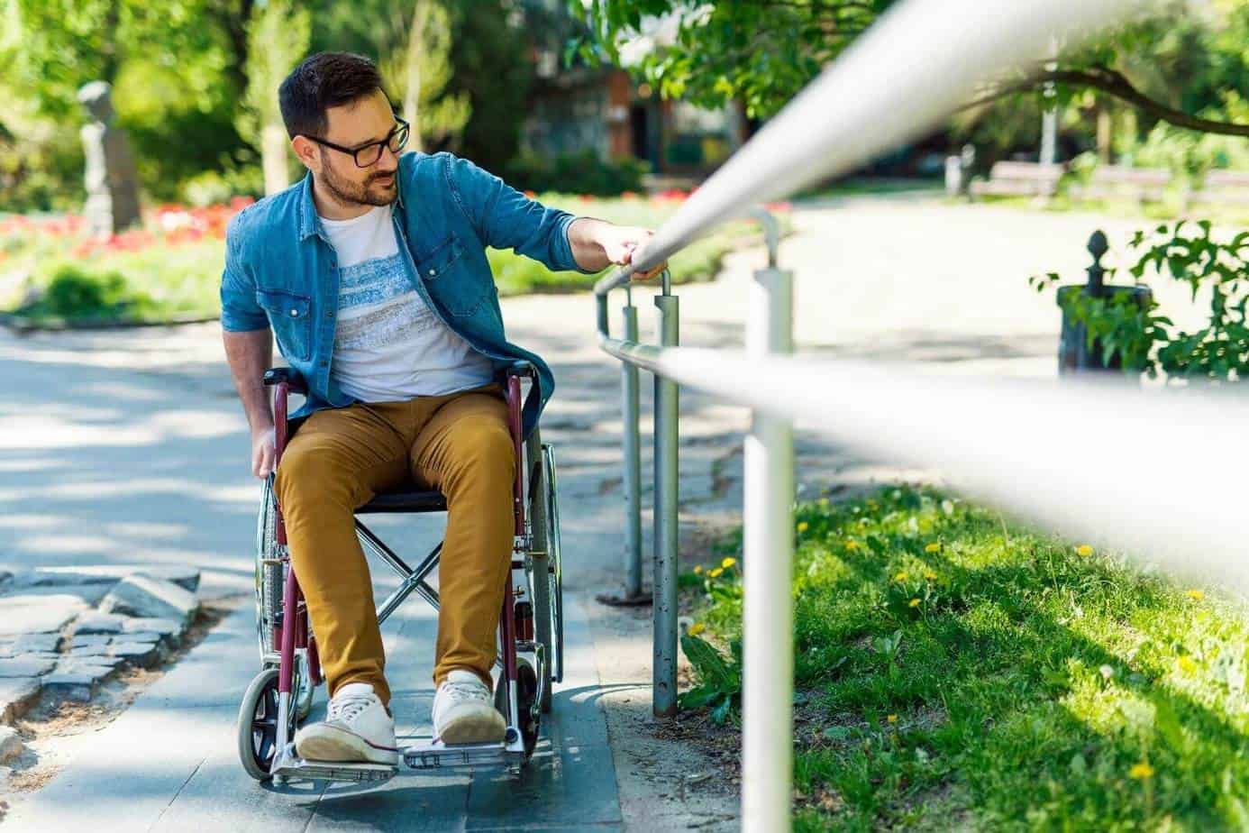 a man using a wheelchair at the park