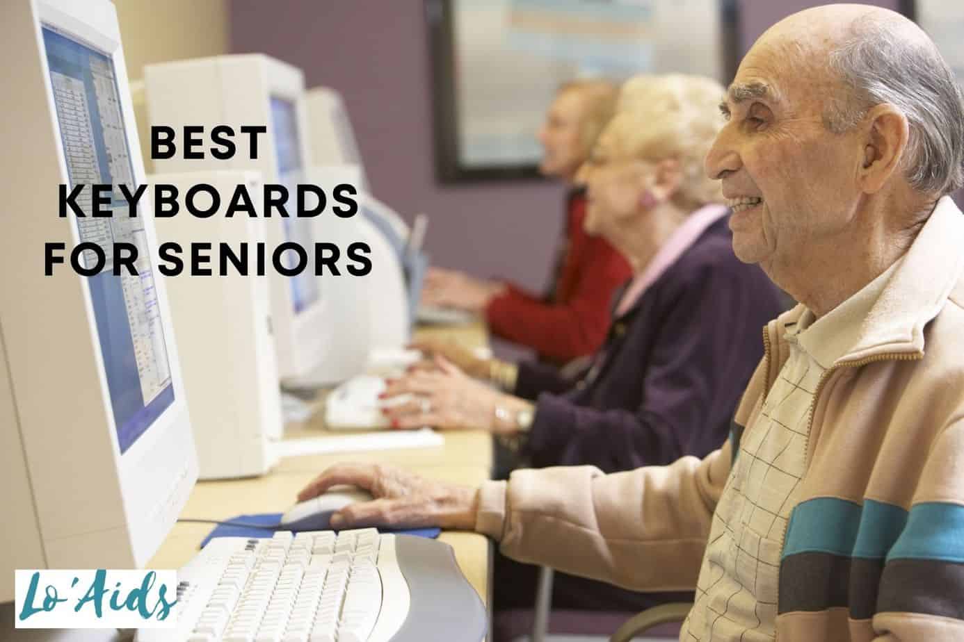 group of older people using a computer with the best keyboards for seniors