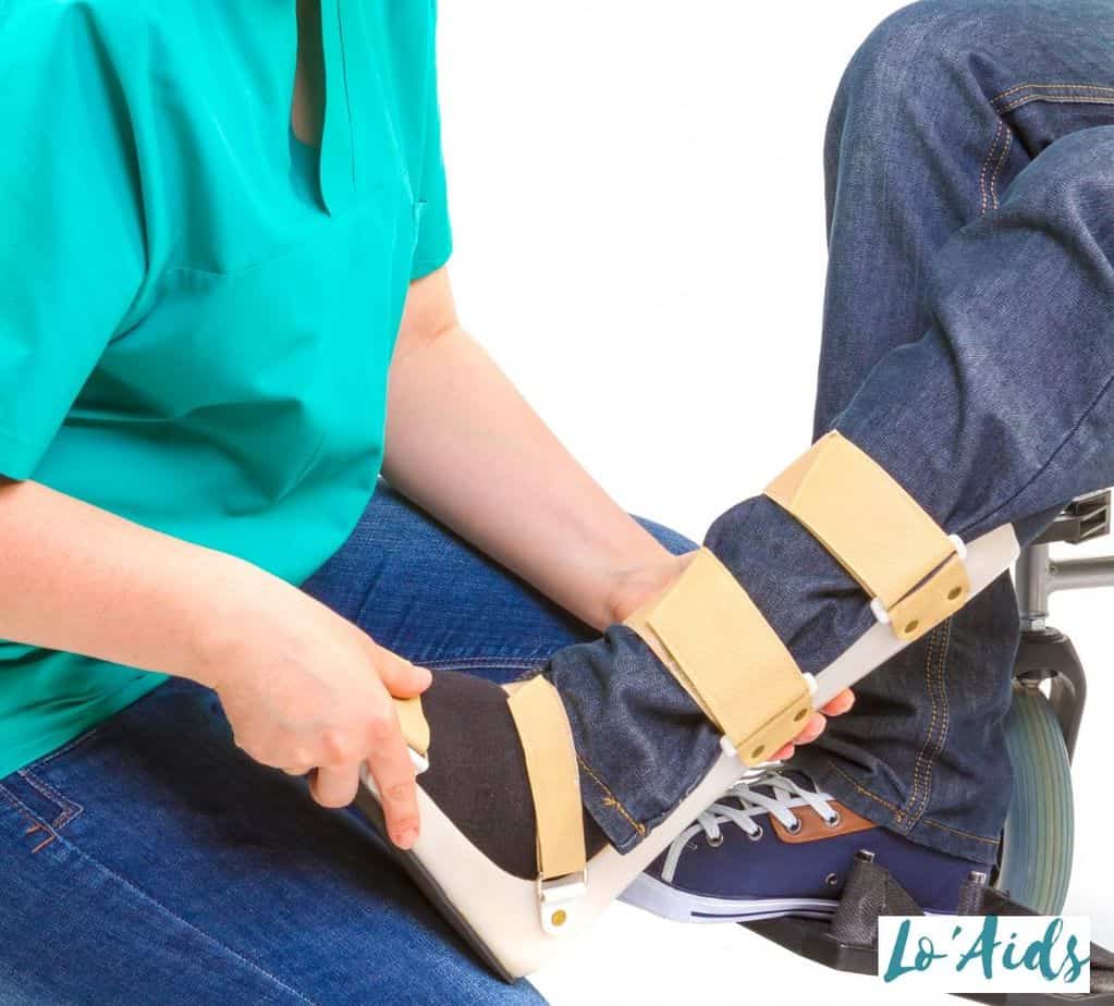 a nurse putting on an AFO brace to a patient's feet: How Does an AFO Help Drop Foot?