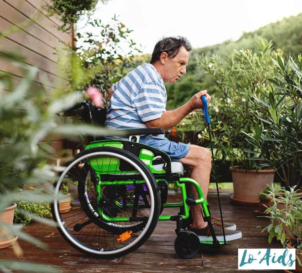 a man doing some wheelchair exercises for seniors in his terrace