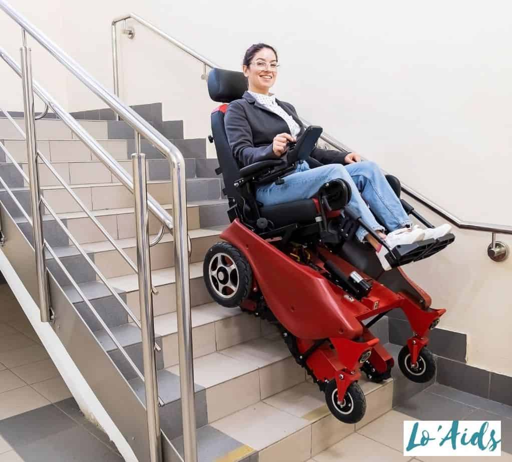 lady happily using a wheelchair that climbs stairs