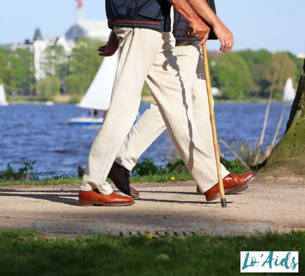 man walking with his wooden cane