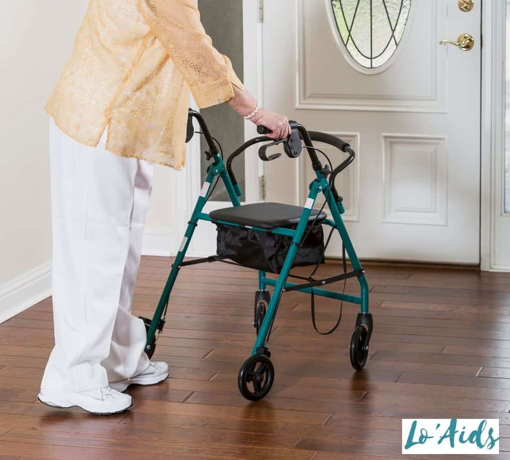 woman showing how to use a rolling walker properly