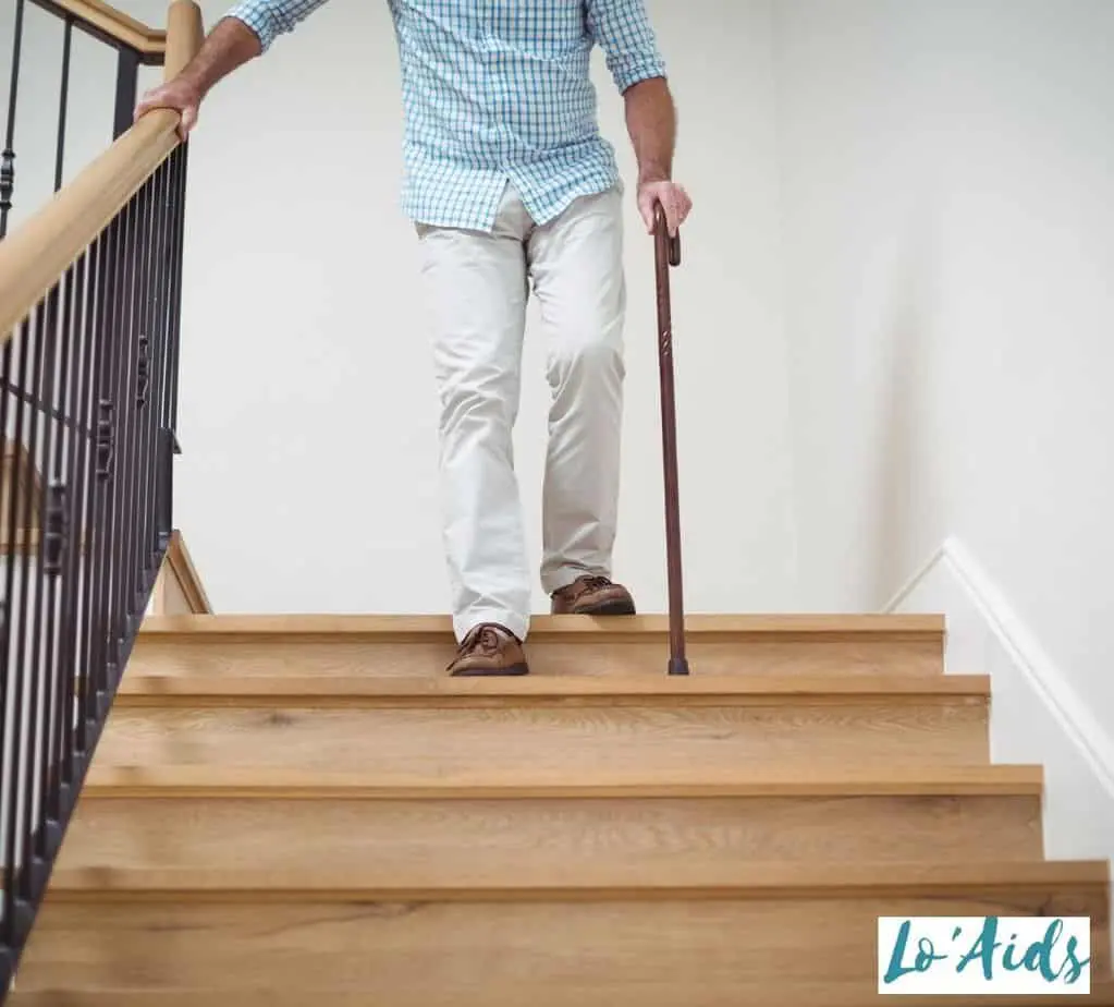 a men getting help with walking cane