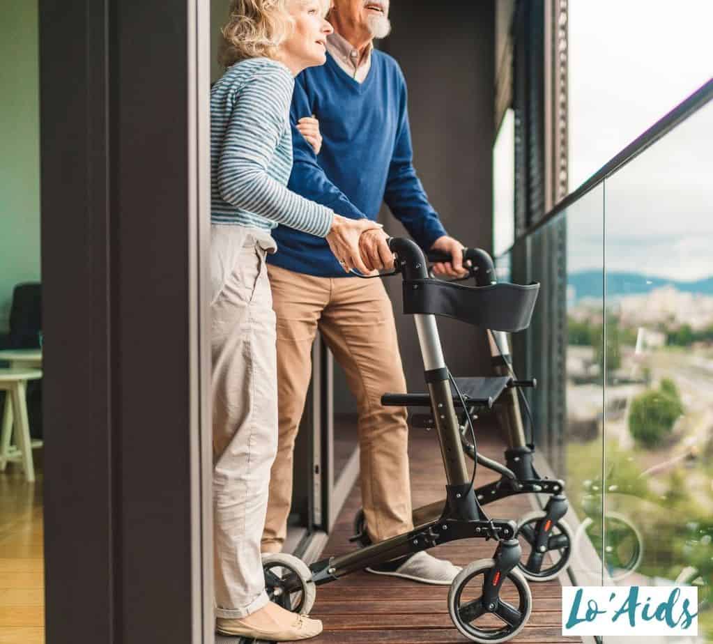 wife assisting his husband to use a rolling walker