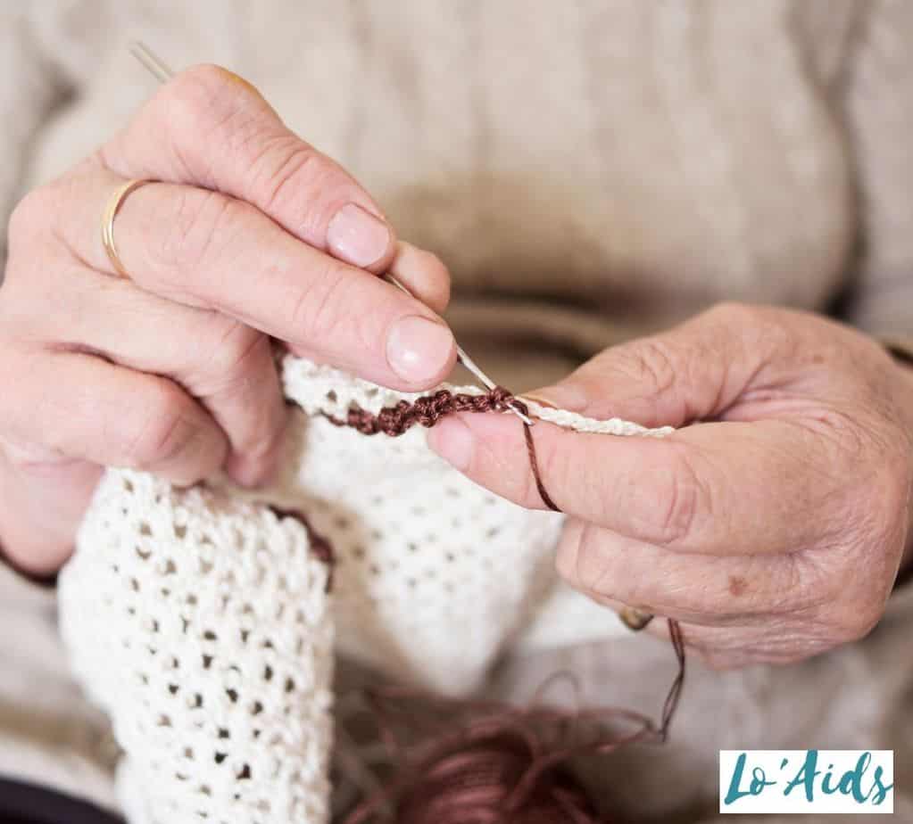 senior woman crocheting