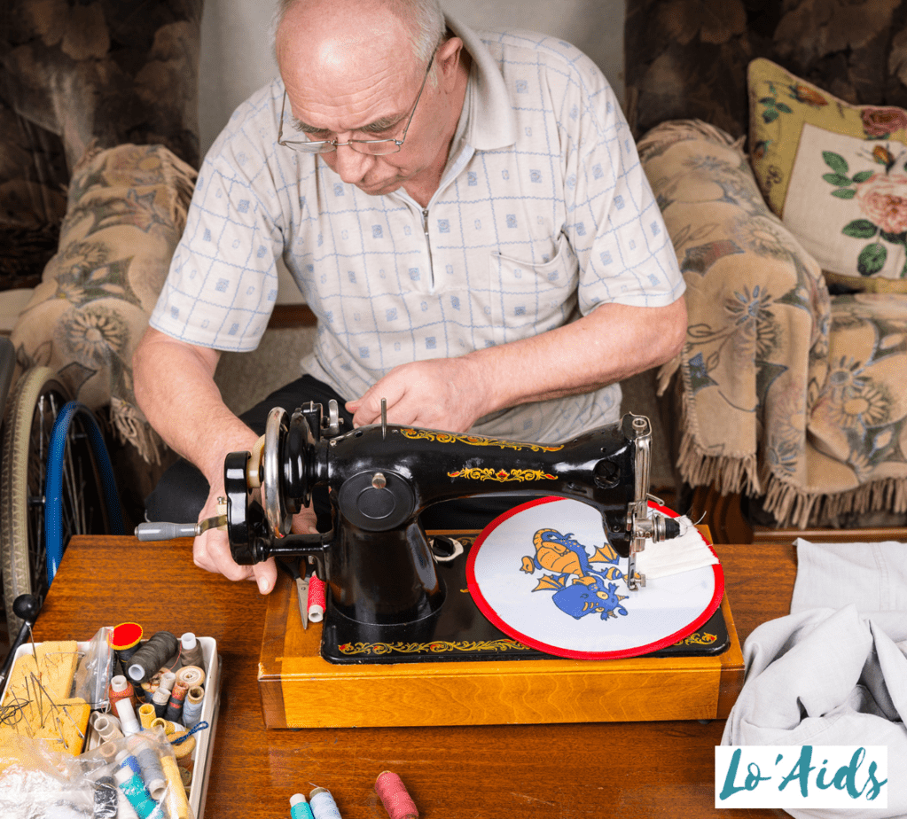 senior man sewing some easy crafts for seniors with dementia