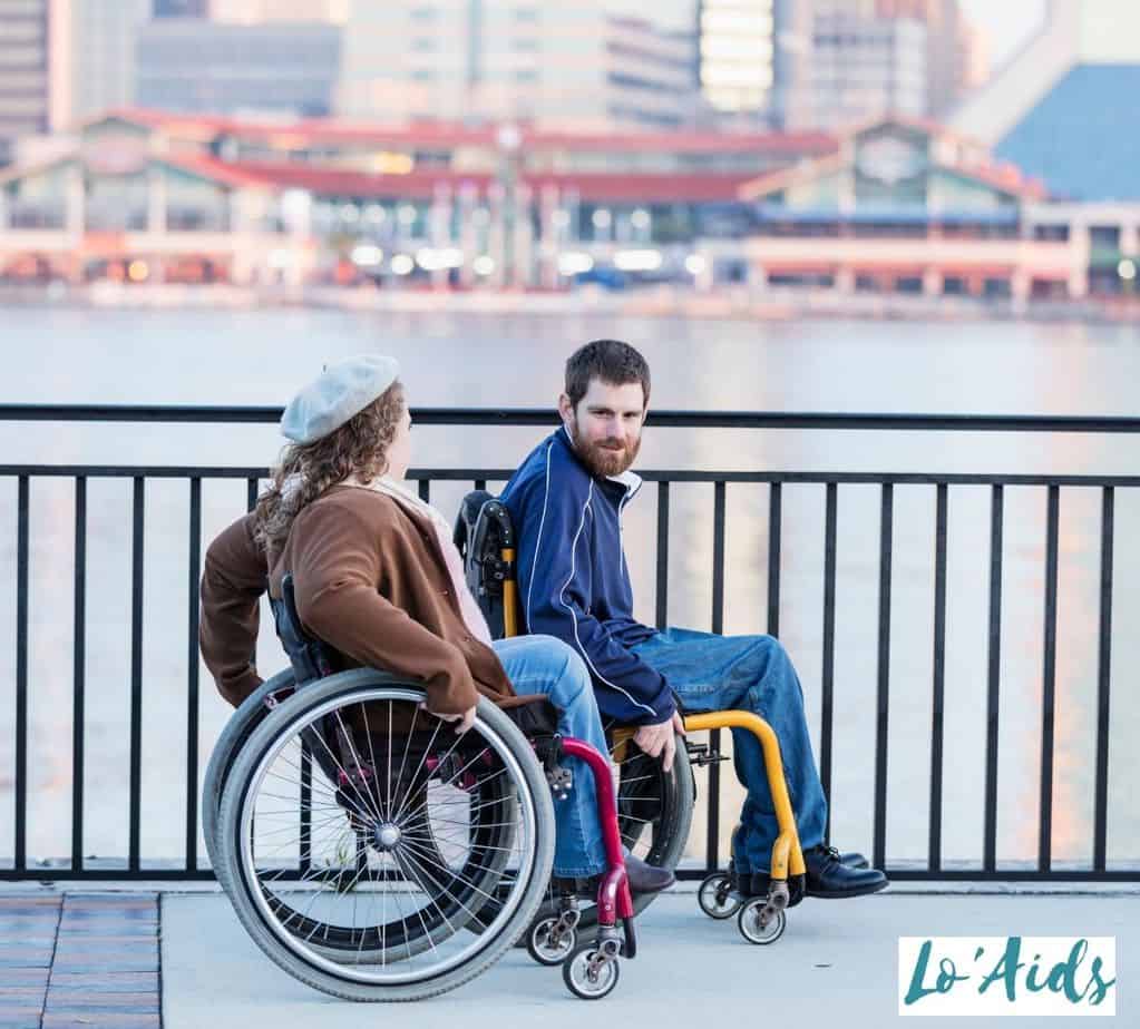 couple roaming around using manual wheelchairs