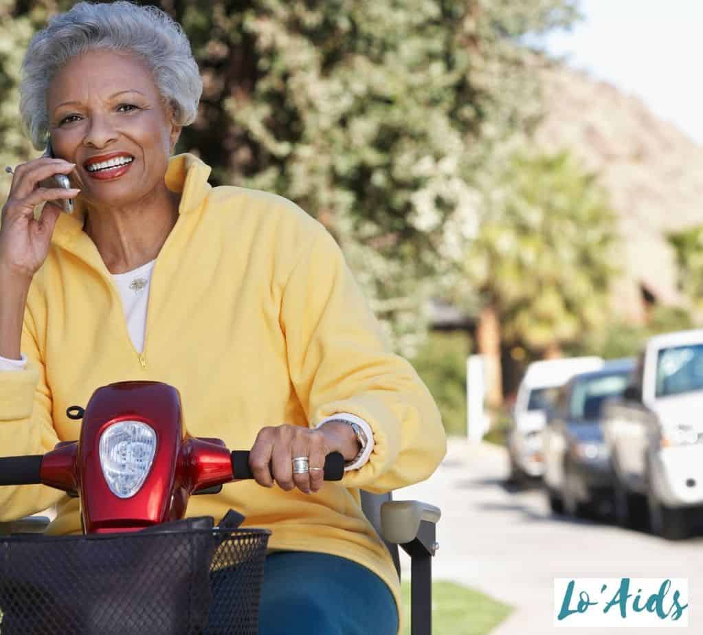 senior woman driving a scooter