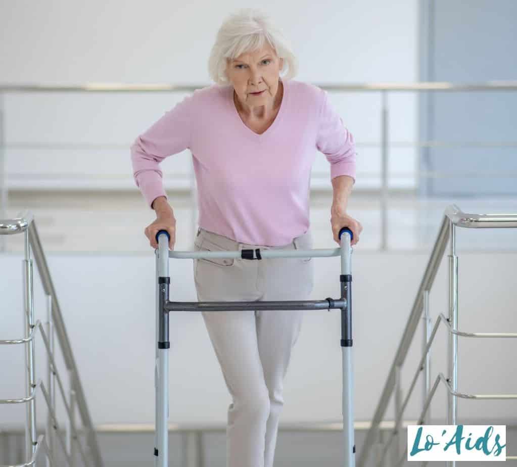 senior woman using a standard walker