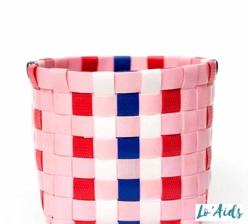 pink, red and blue weaved paper basket craft activity for people with Parkinson's disease