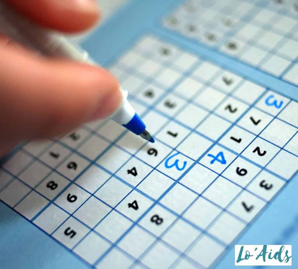 a person filing out sodoku