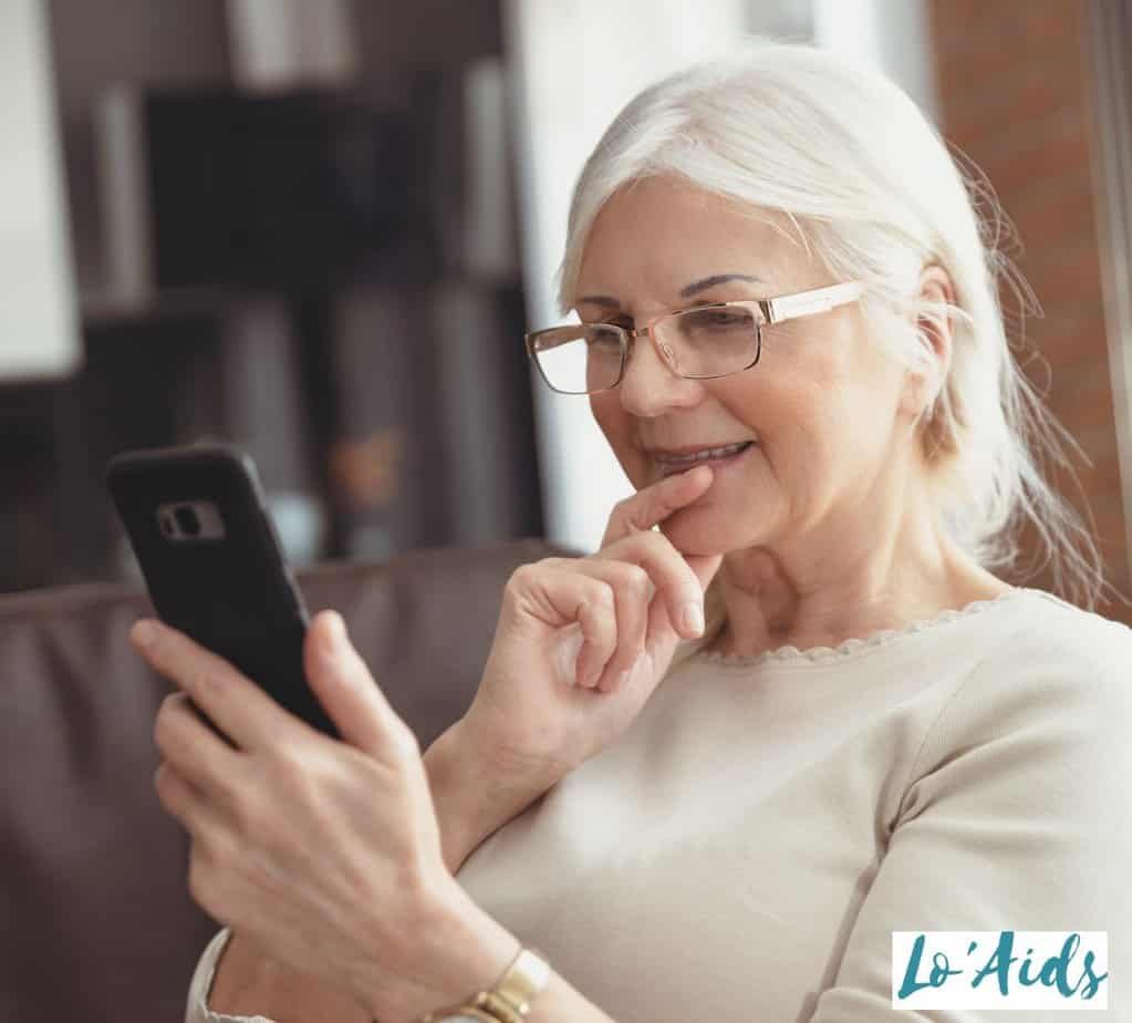 senior lady signing up in online dating apps