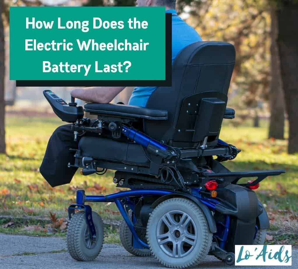 handicapped man in an electric wheelchair beside "how long does the electric wheelchair battery last" sign