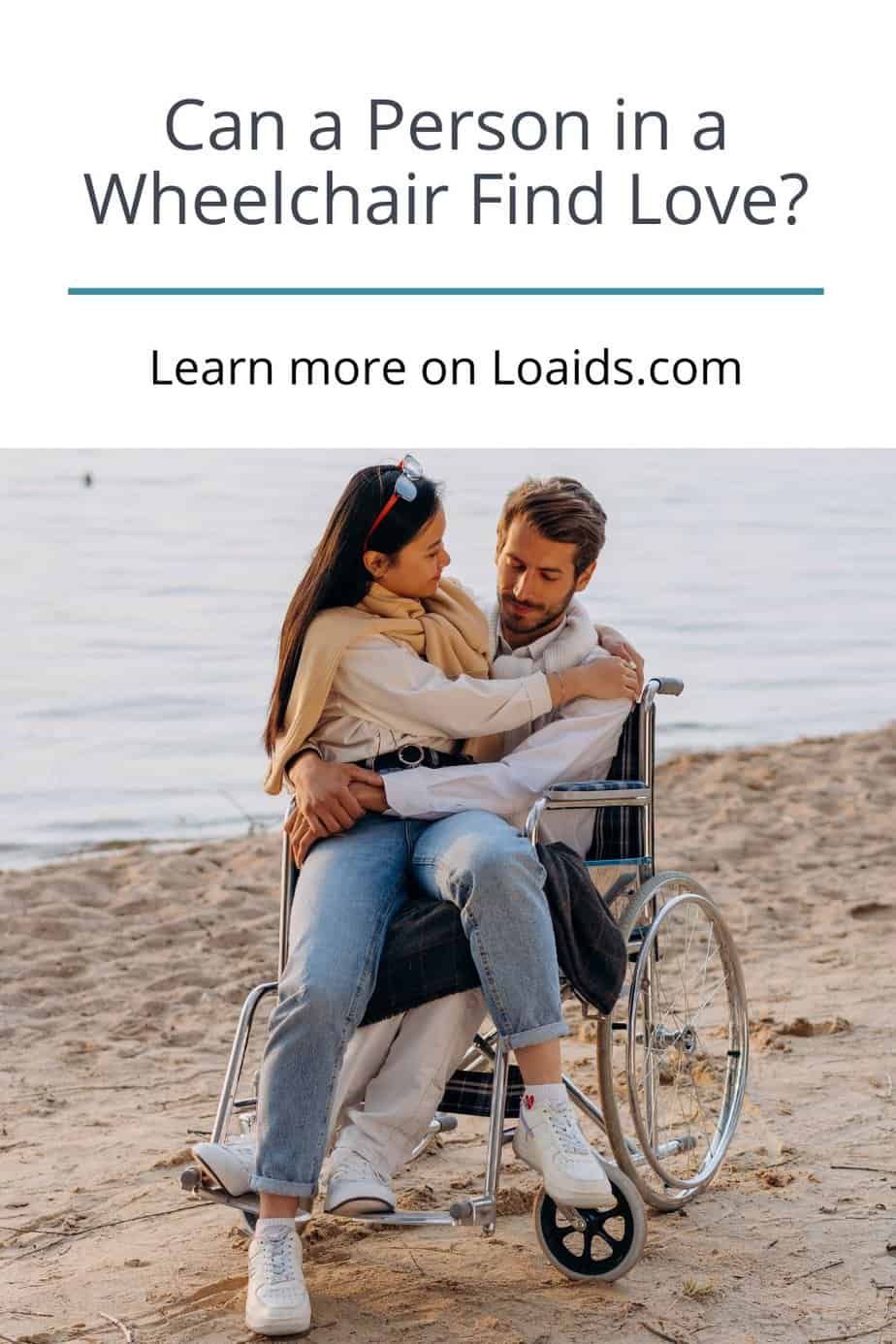 woman sitting on the lap of a man in a wheelchair