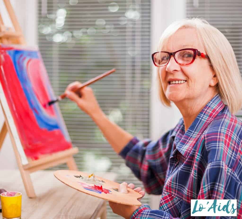 An Elder women doing painting