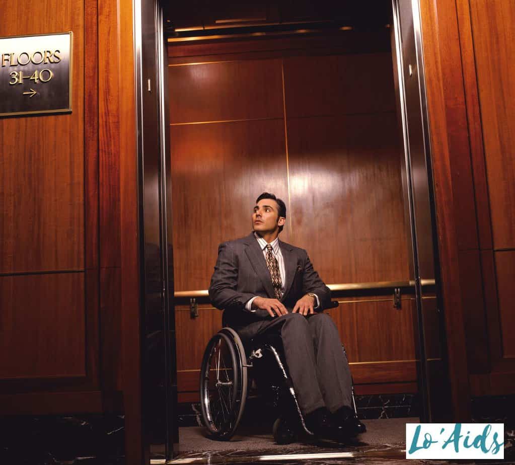Wheelchair men in elevator