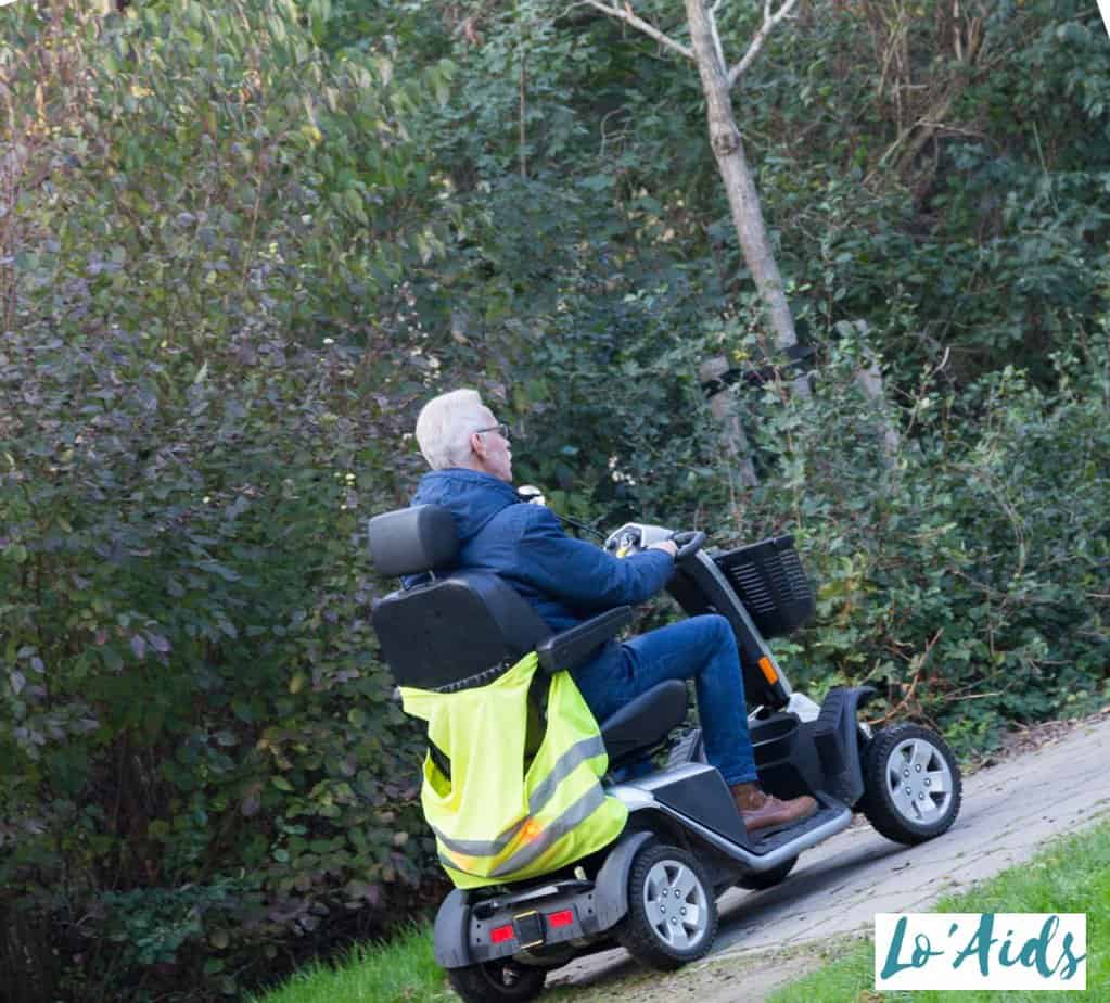 men riding mobility scooter on hill, while some wants to know can mobility scooters go up hills