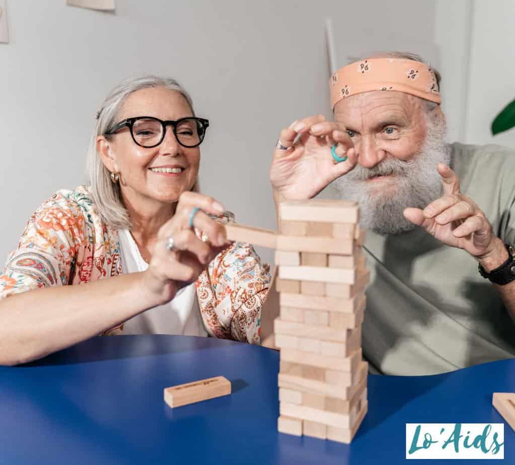 senior couple playing jenga