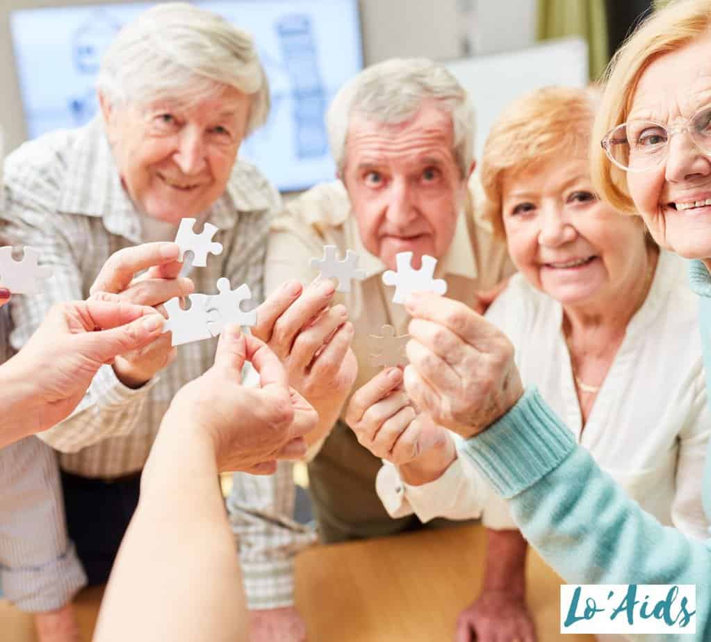 senior citizens playing jigsaw puzzles