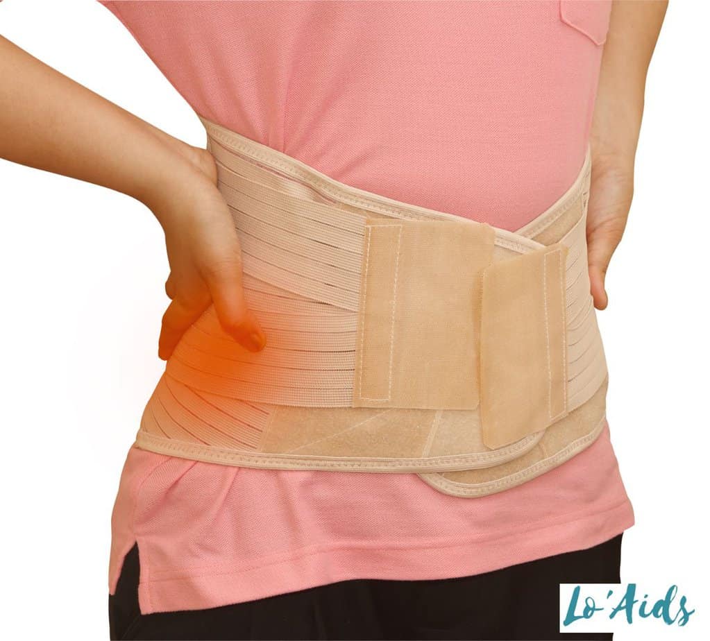 lady wearing a cream back brace for her back pain