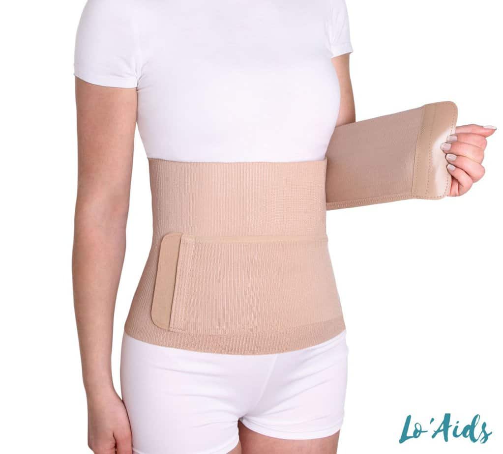 lady putting on her back brace