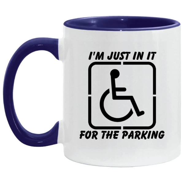 White coffee mug with saying" I'm just in it for the parking" and a picture of a wheelchair